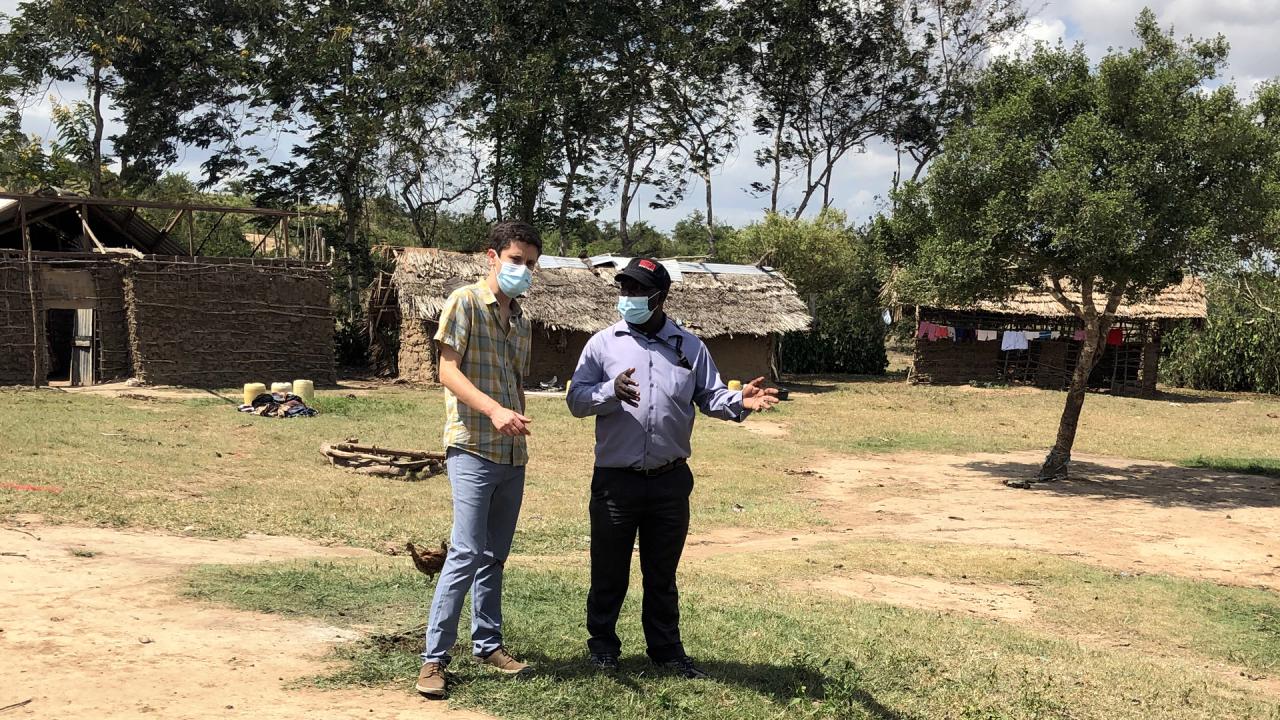 Felix Agoi and Josh Ehrlich in Kilifi, Kenya, on a site where pilot testing for LOSHAK will be conducted