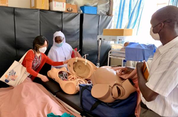 HaEun Lee, Impact Scholar with the Center for Global Health Equity, University of Michigan, gets a tour of the simulation lab at the Virika School of Nursing and Midwifery in Fort Portal, Uganda.