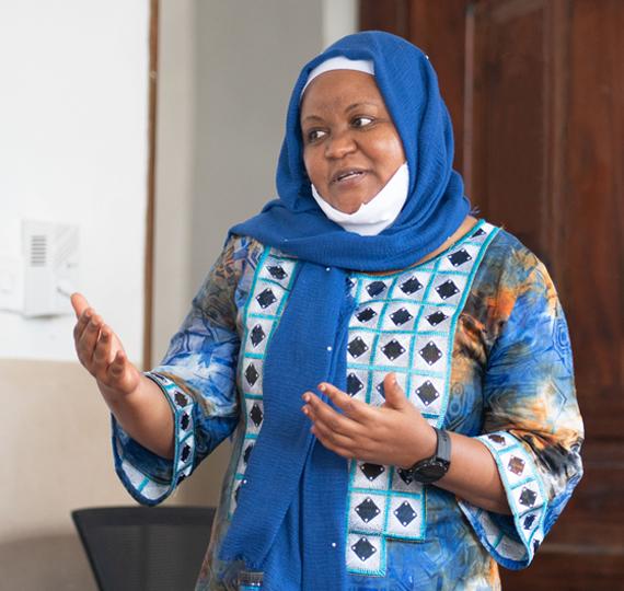 Amina Abubakar discusses research data in Kaloleni, Kenya