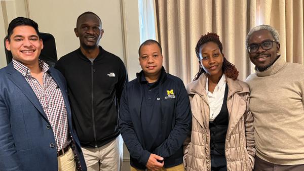 Ryan Rego, Victor Rateng, Leon Espira, and Purity Muthoni with Lukoye Atwoli—Dean of the Aga Khan University Medical College–East Africa—on campus at the University of Michigan.