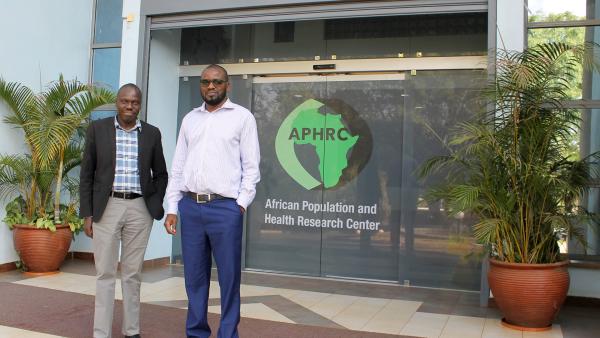 Vaccine Researchers Gershim Asiki and Martin Mutua in front of the African Population and Health Research Center in Nairobi, Kenya