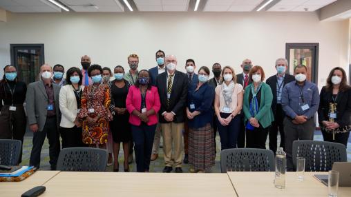 Many Aga Khan partners with the University of Michigan delegation, all in masks