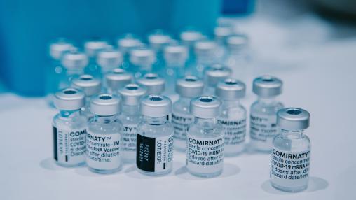glass bottles of COVID-19 vaccine